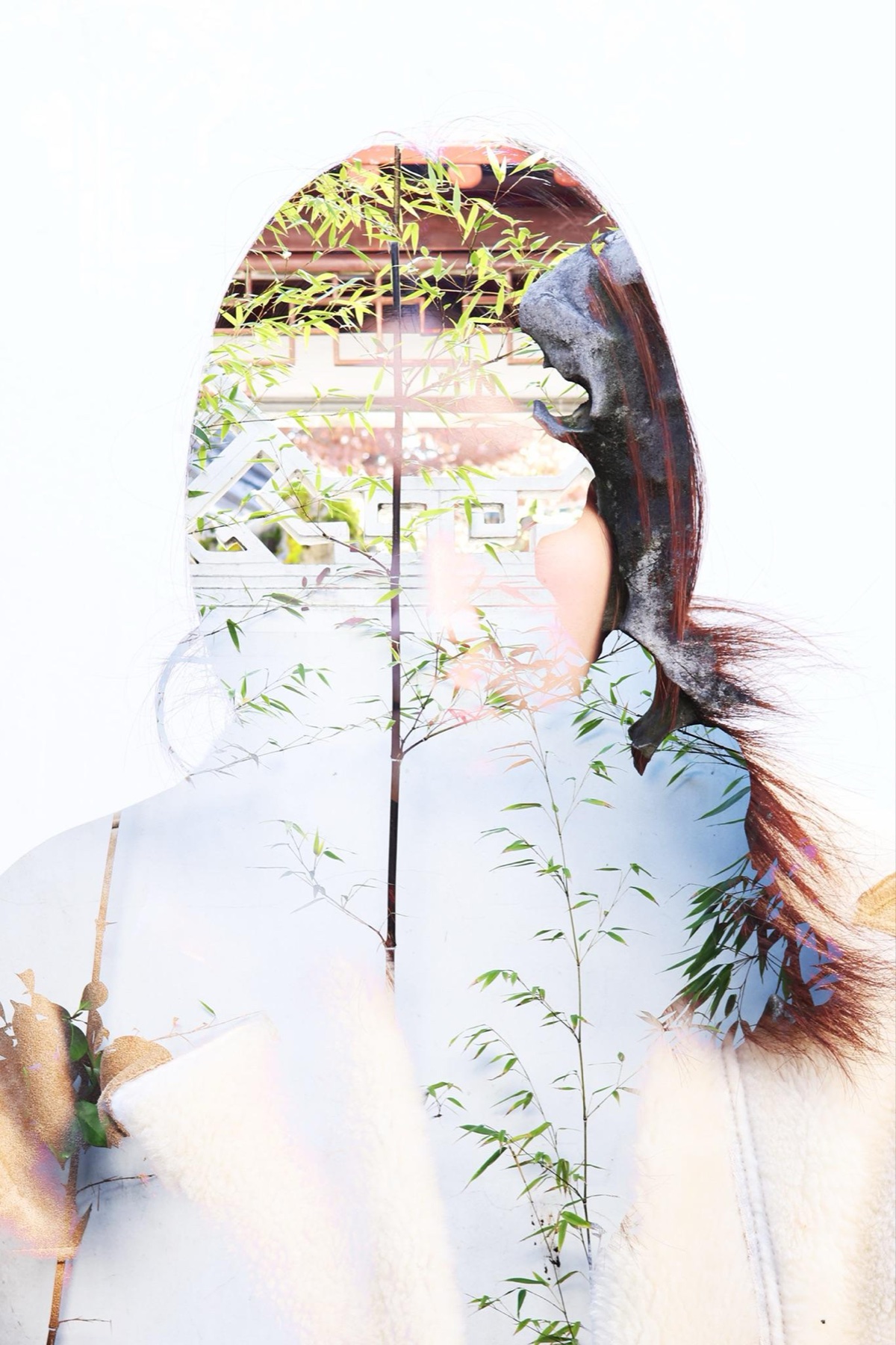 Double exposure portrait blended with a traditional Chinese garden